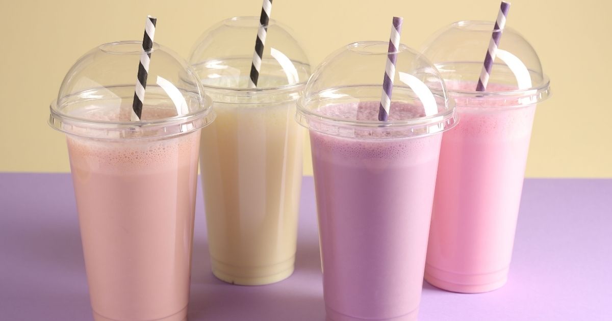 Colorful Dutch Bros secret menu drinks with straws and stickers